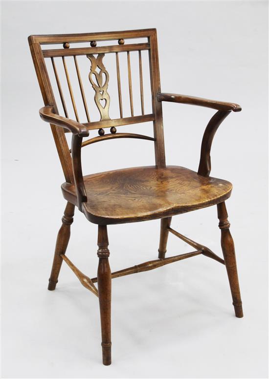 A 19th century boxwood inlaid fruitwood and elm Mendlesham elbow chair,